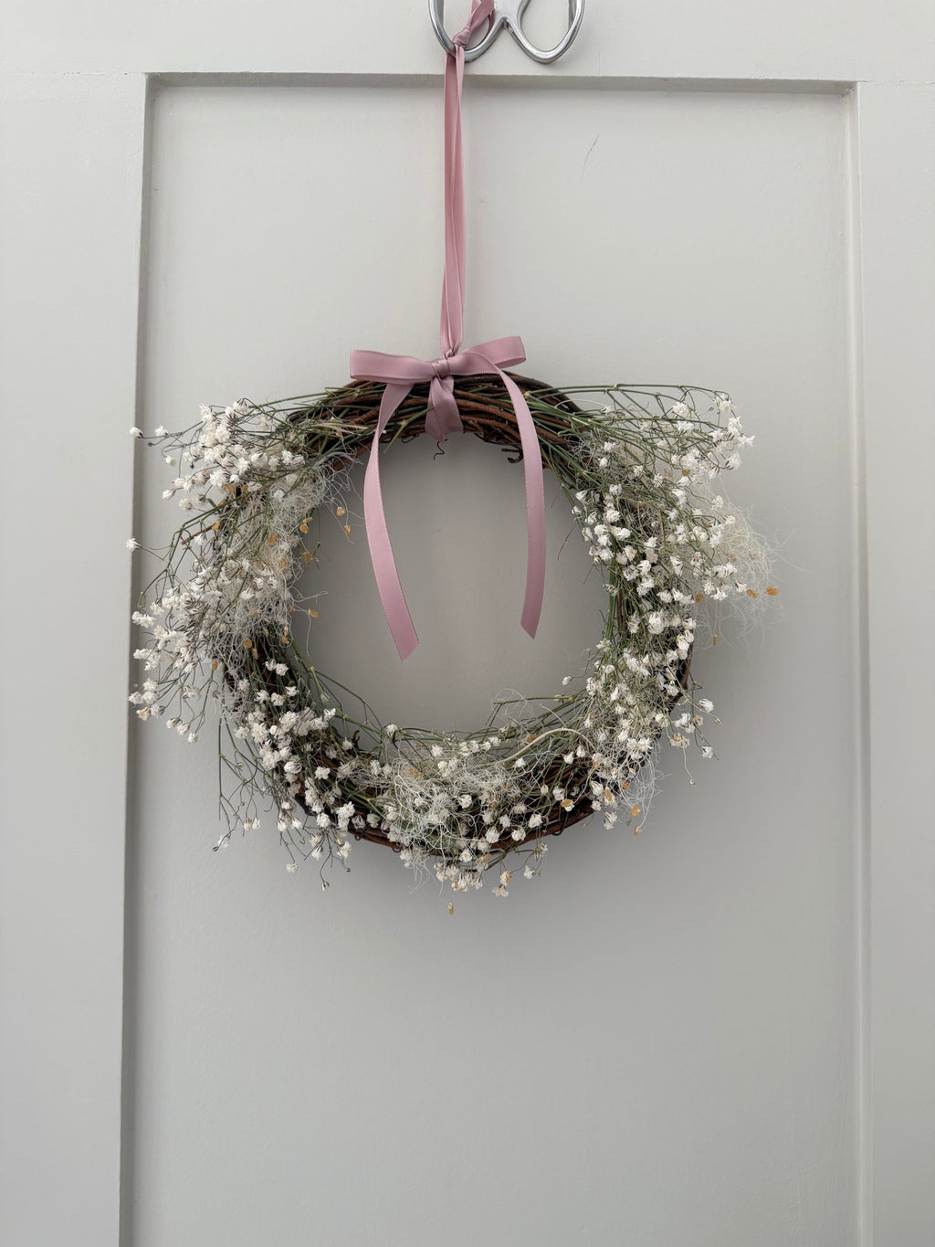 Lois’ Wreath with Gypsophilas and Cotinus coggygria finished with a pink bow 20cm - (included in 15% off offer)