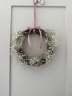 Lois’ Wreath with Gypsophilas and Cotinus coggygria finished with a pink bow 20cm