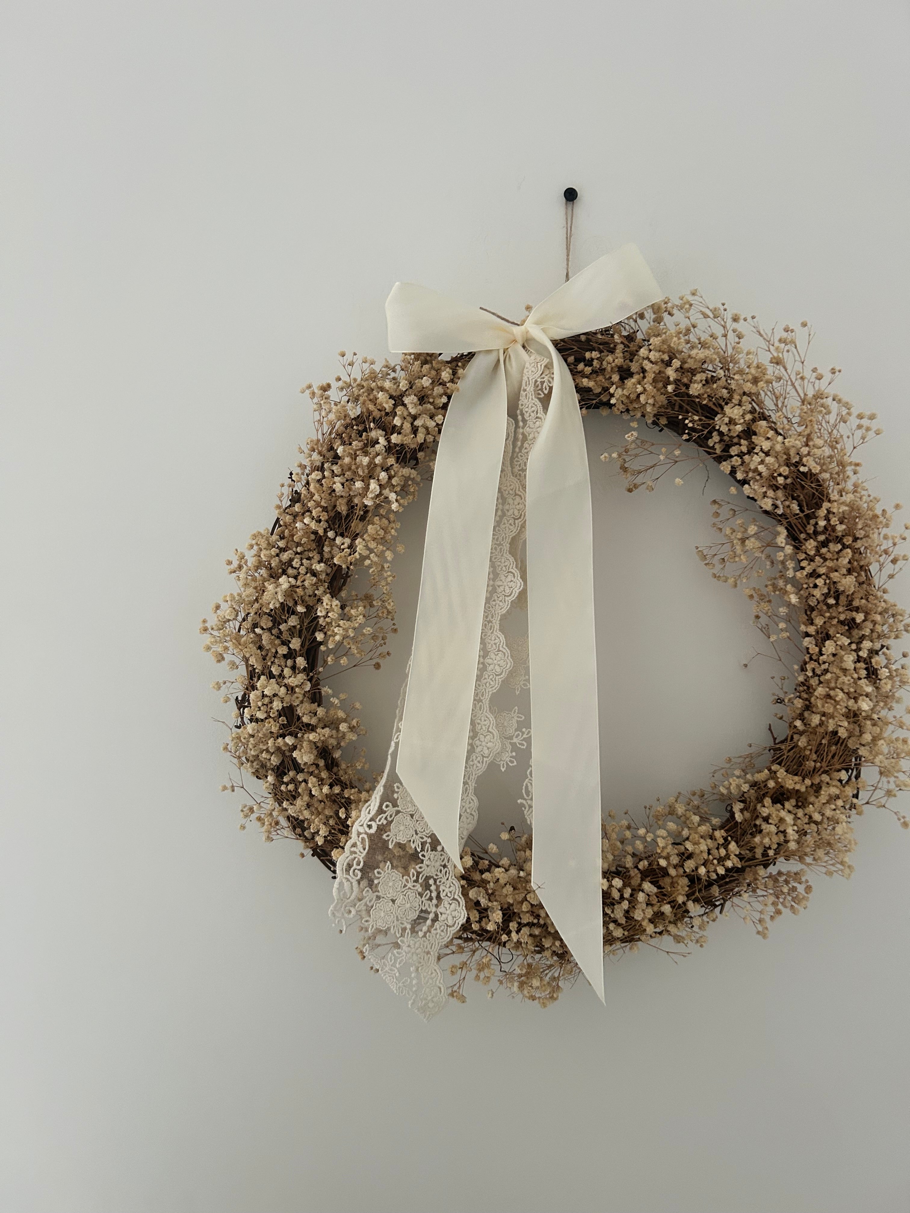 ‘Aurora’ Gypsophila Wreath finished with a cream satin & lace bow