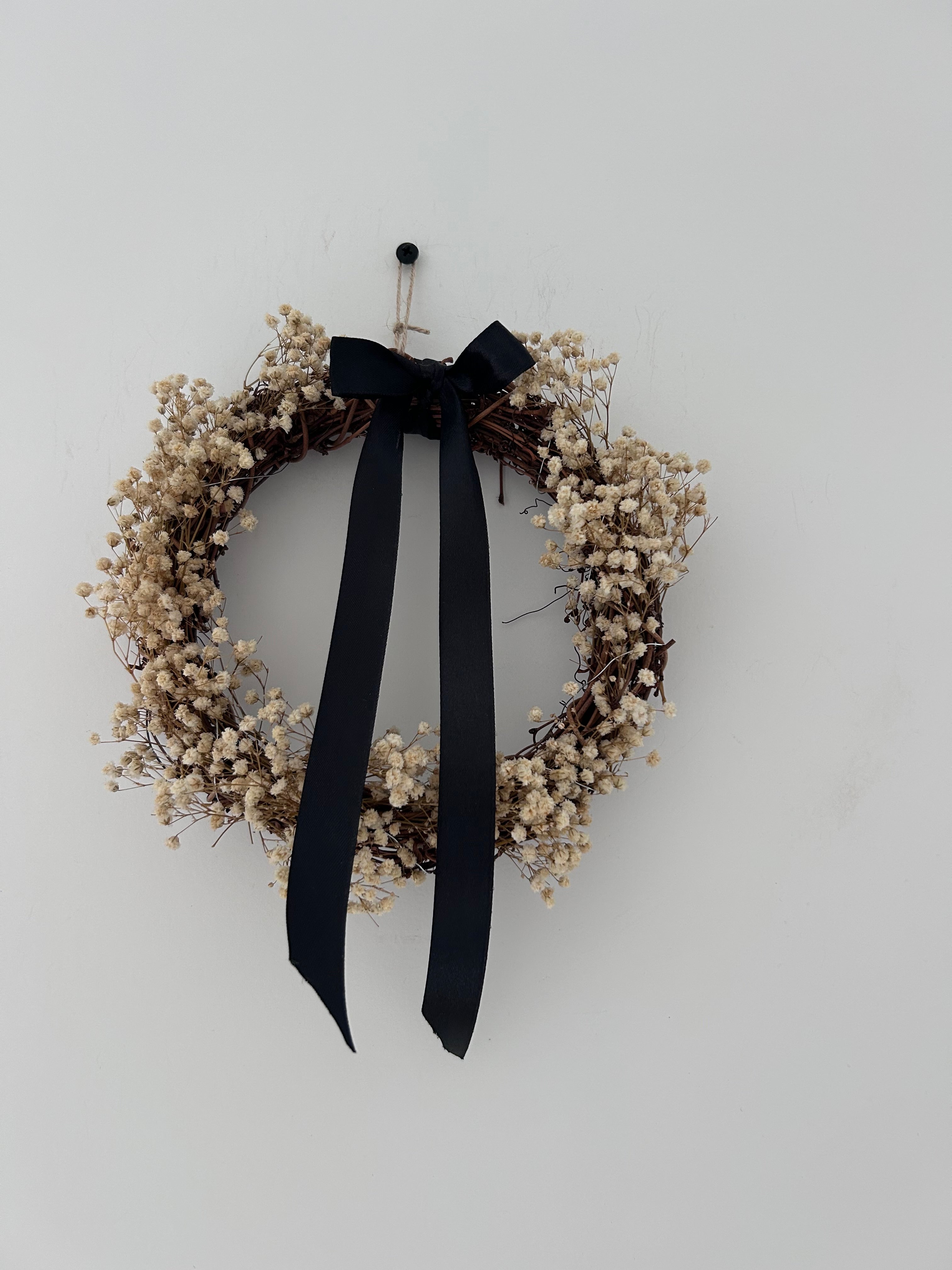 ‘Onyx’ Wreath with Gypsophilas finished with a black bow (bells optional)