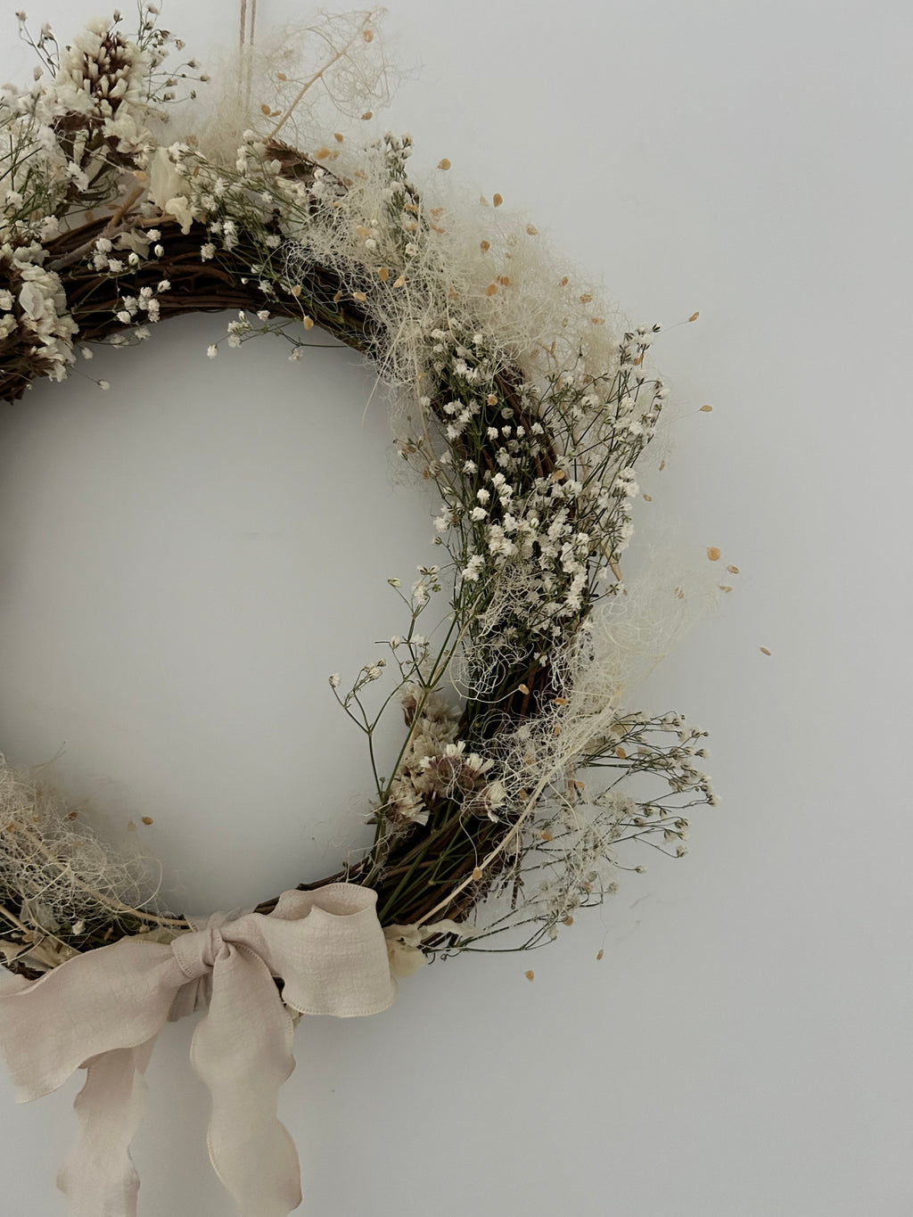‘Linen’ Wreath with Cotinus coggygria, Gypsophilas and White Statice finished with cream bow 30cm
