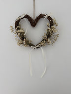 25cm heart wreath with white statice, gypsophilas finished with ivory bows