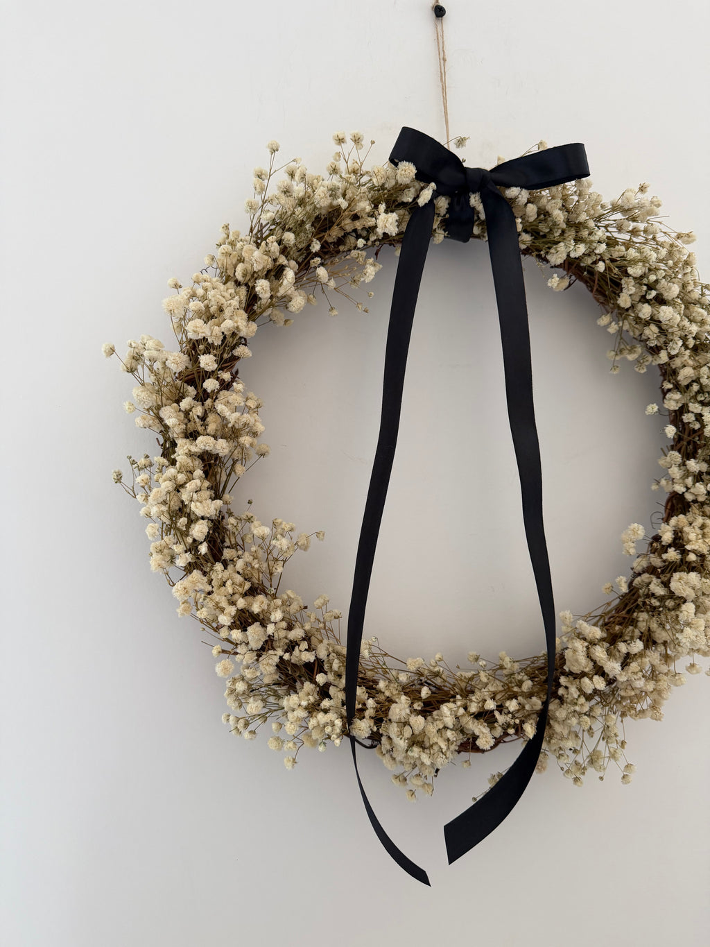 ‘Onyx’ Wreath with Gypsophilas finished with a black bow