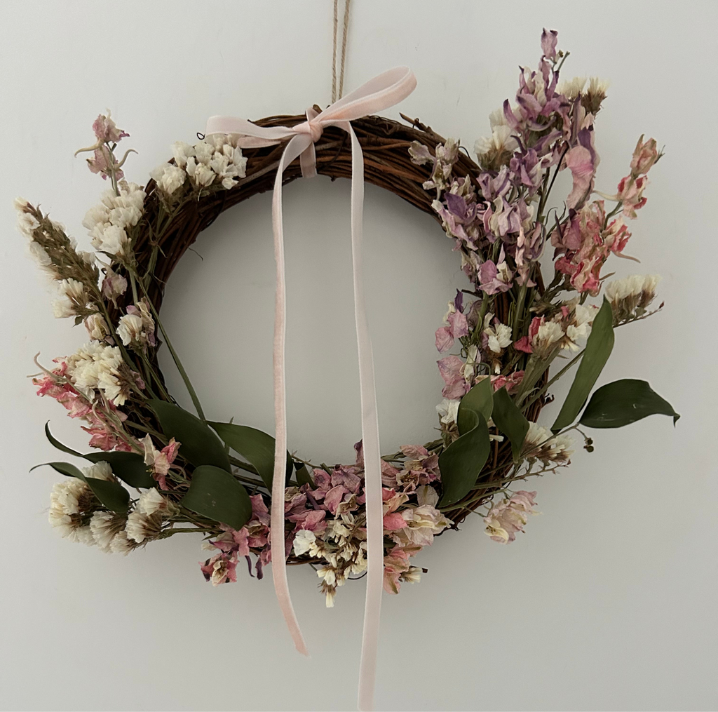 *ONE OFF SAMPLE* ‘Posy’ Wreath with white statice, ruscus and mixed colour delphiniums finished with a light pink ribbon 20cm