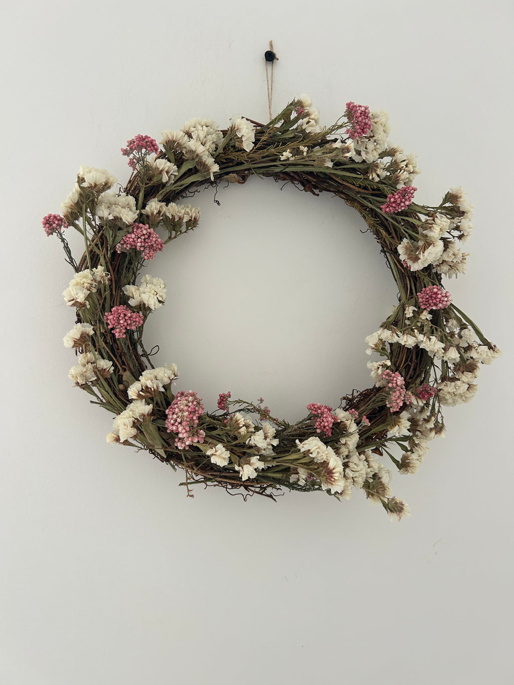 Blossom’ Wreath with White Statice and pink rice flowers