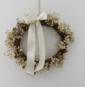 ‘Luchia’ Wreath with white statice, gypsophilas finished with a cream bow