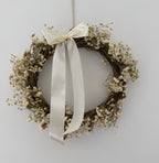 ‘Luchia’ Wreath with white statice, gypsophilas finished with a cream bow