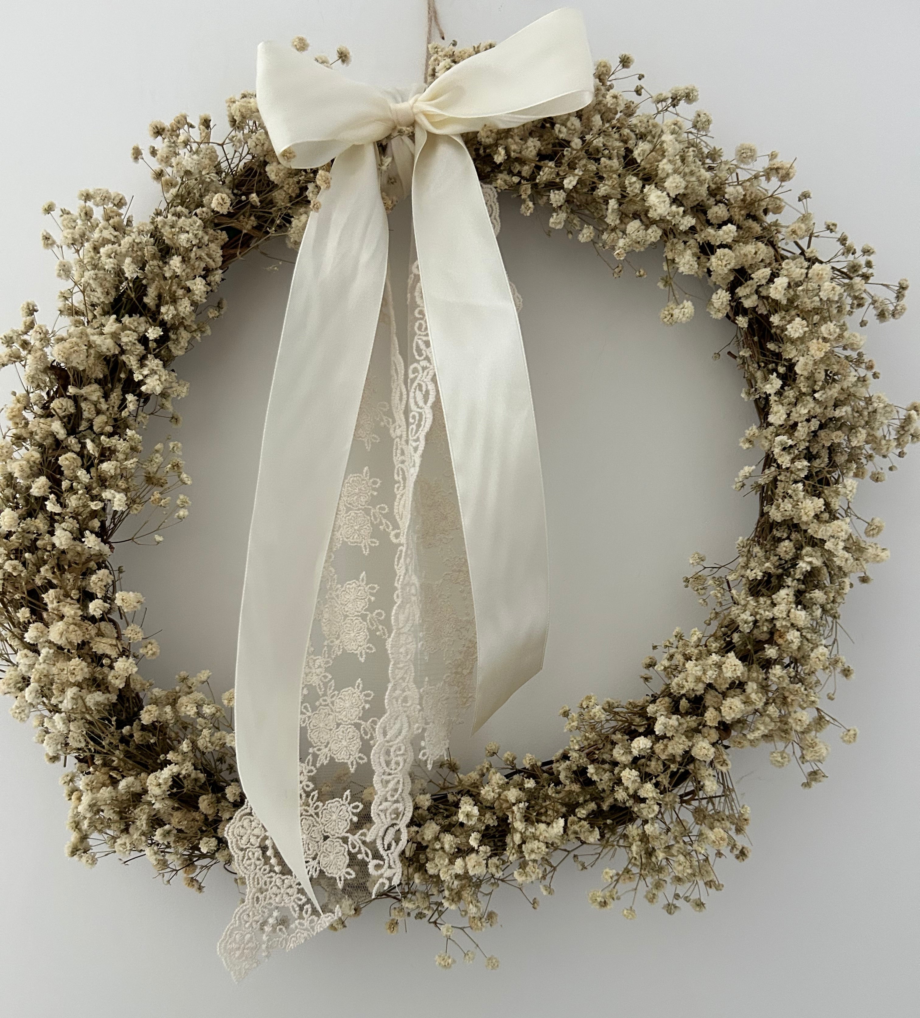 ‘Aurora’ Gypsophila Wreath finished with a cream satin & lace bow