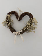 20cm heart wreath with gypsophilas finished with a ivory velvet bow