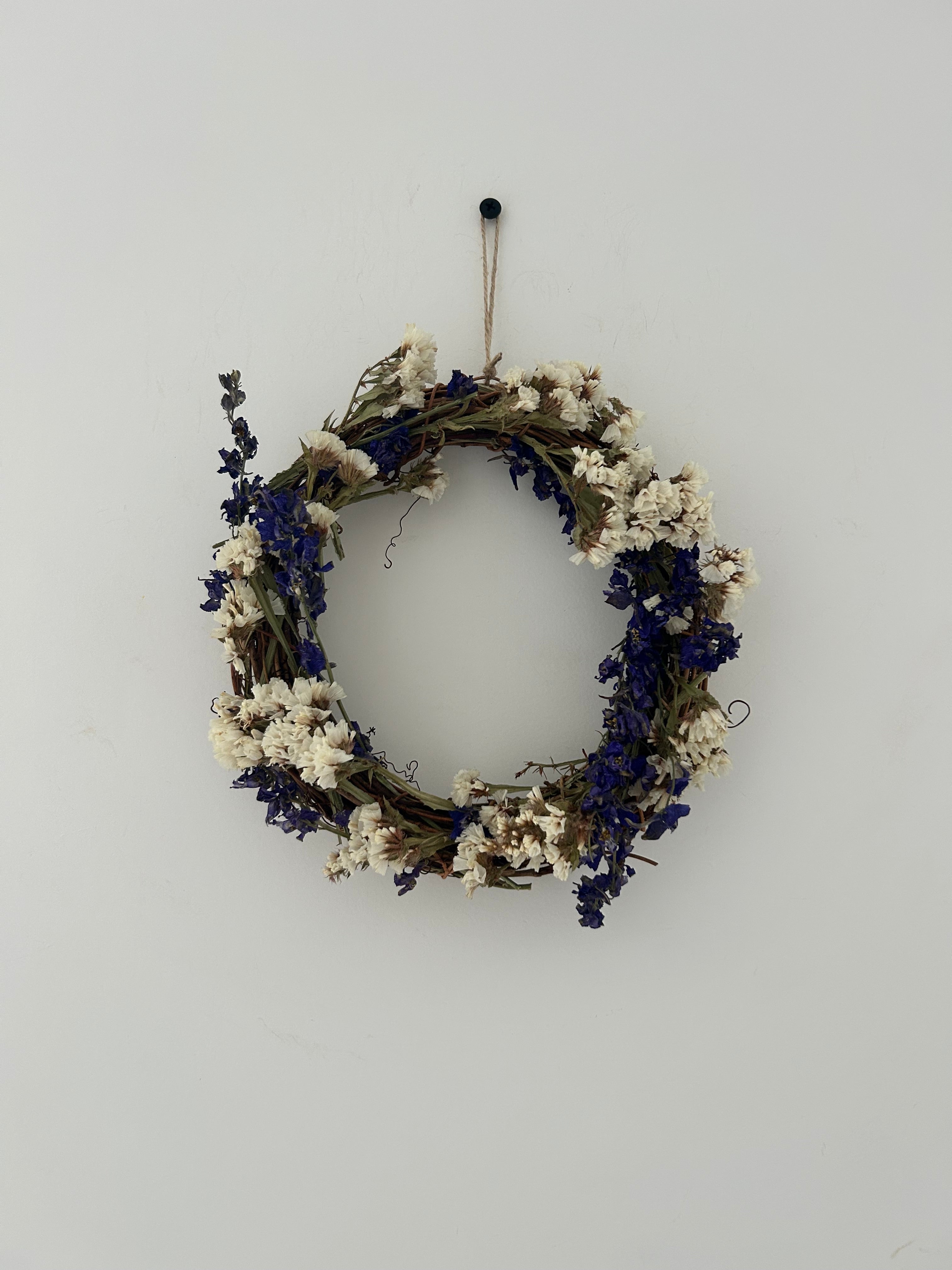 ‘Violet’ Wreath with White Statice and Dark Purple Delphiniums 20cm