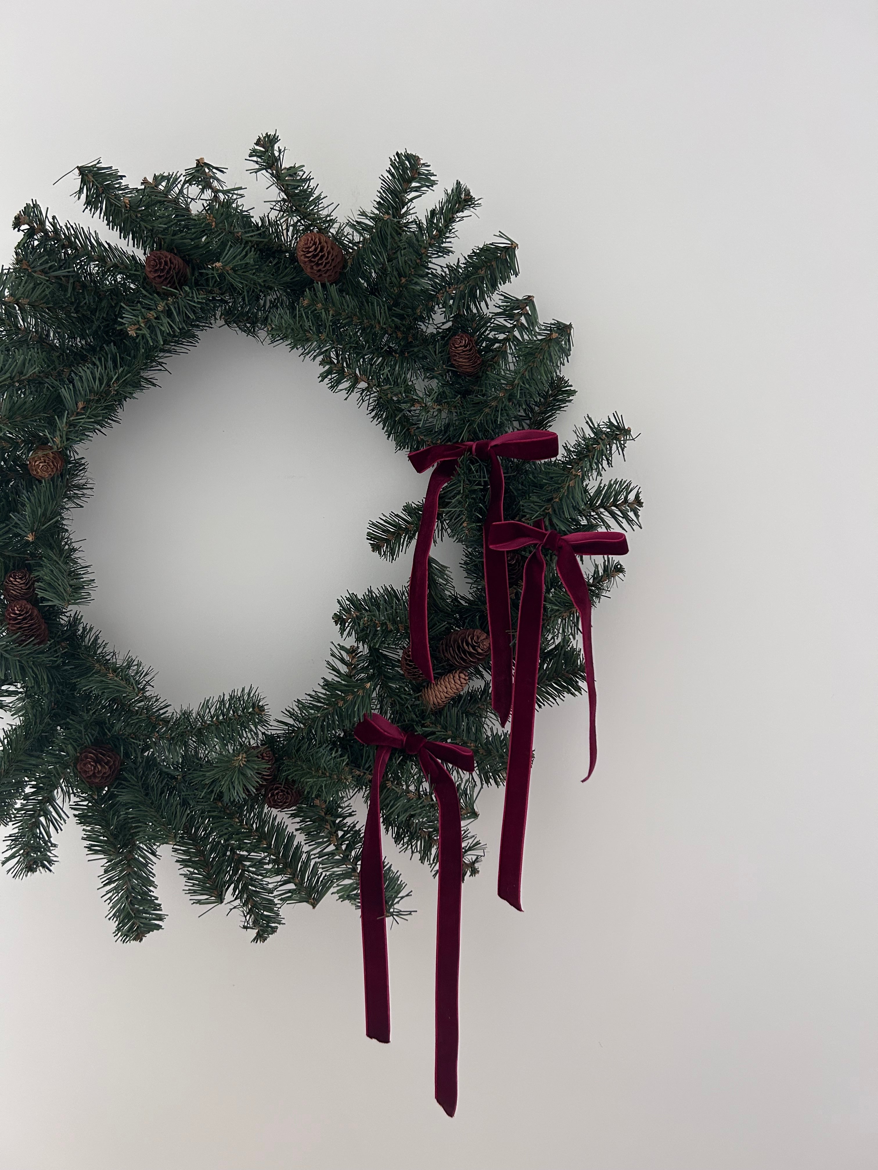 ‘Belle’ Faux Christmas Wreath with red velvet bows & pine cones - 60cm