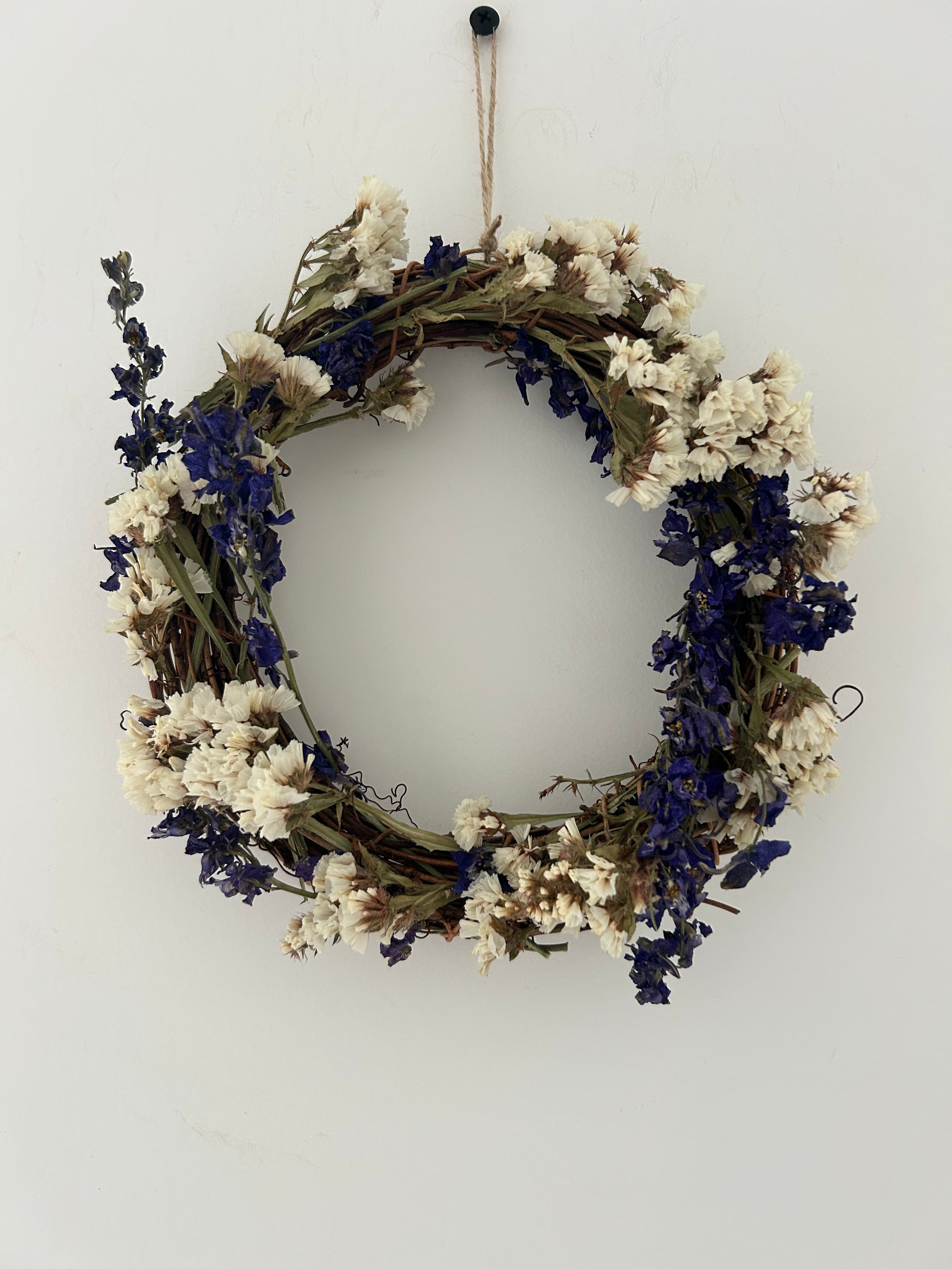 ‘Violet’ Wreath with White Statice and Dark Purple Delphiniums 20cm