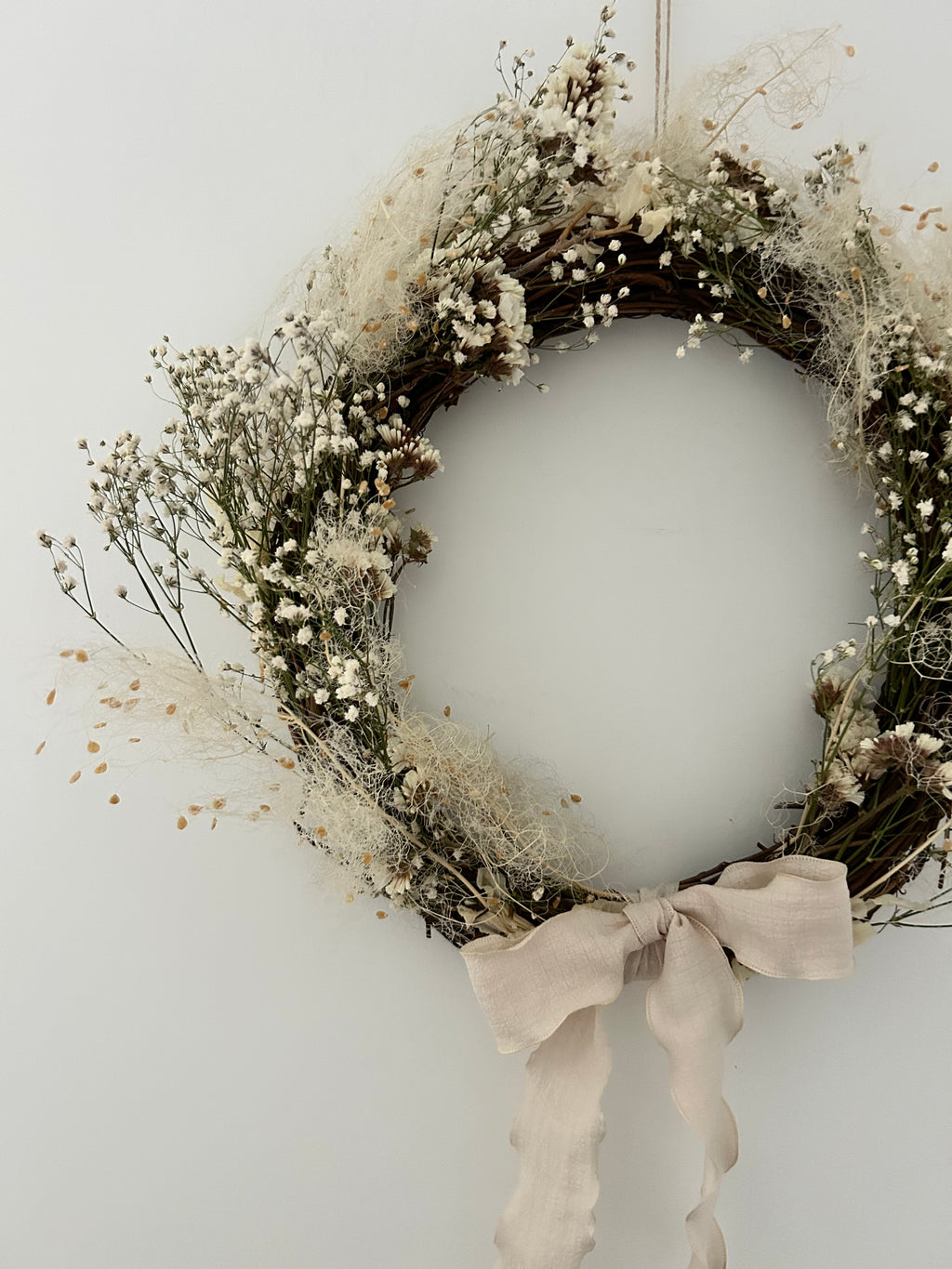 ‘Linen’ Wreath with Cotinus coggygria, Gypsophilas and White Statice finished with cream bow 30cm