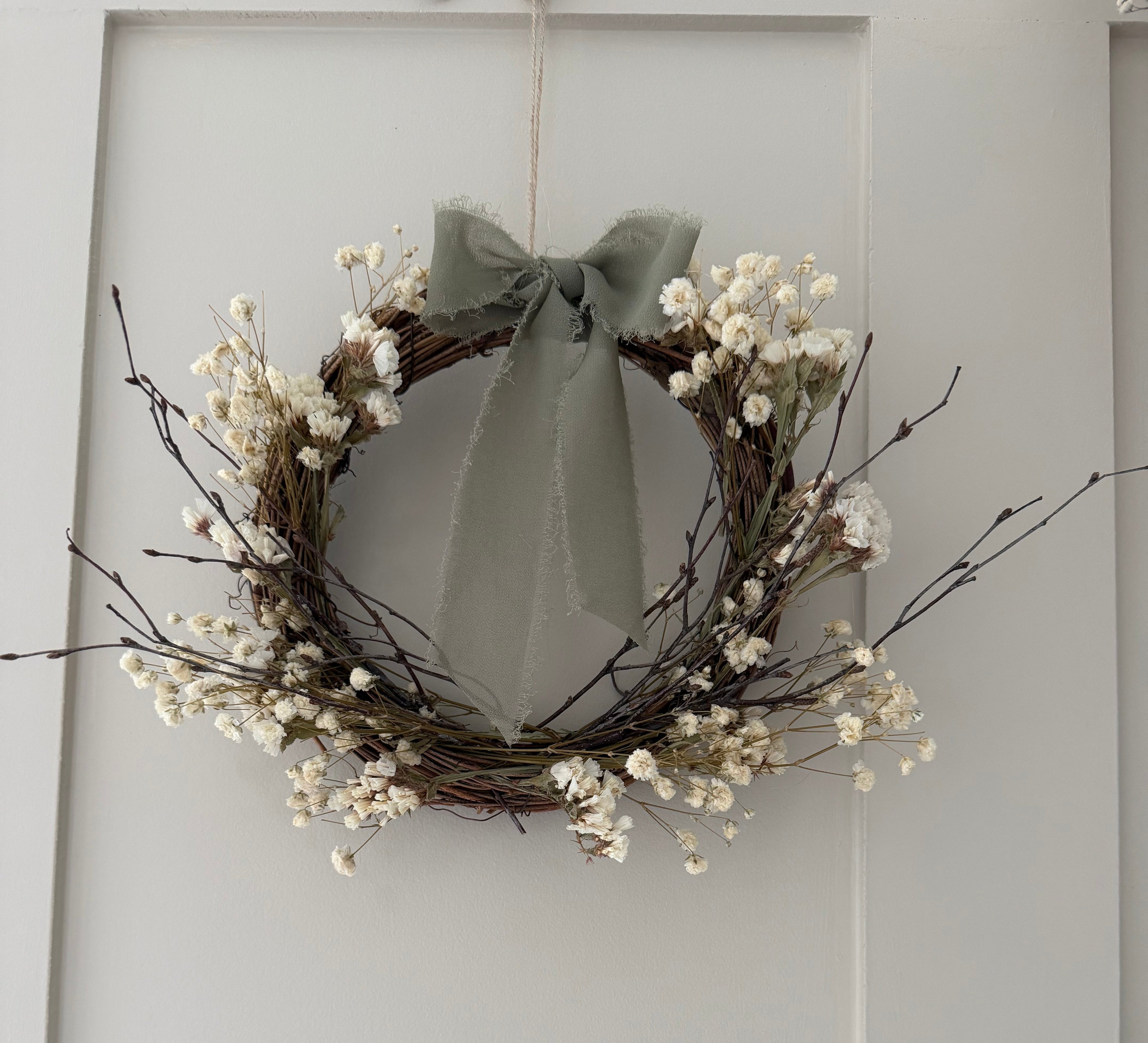 *one off sample* 20cm Wreath with white statice, gypsophilas & dried birch twigs finished with a sage bow