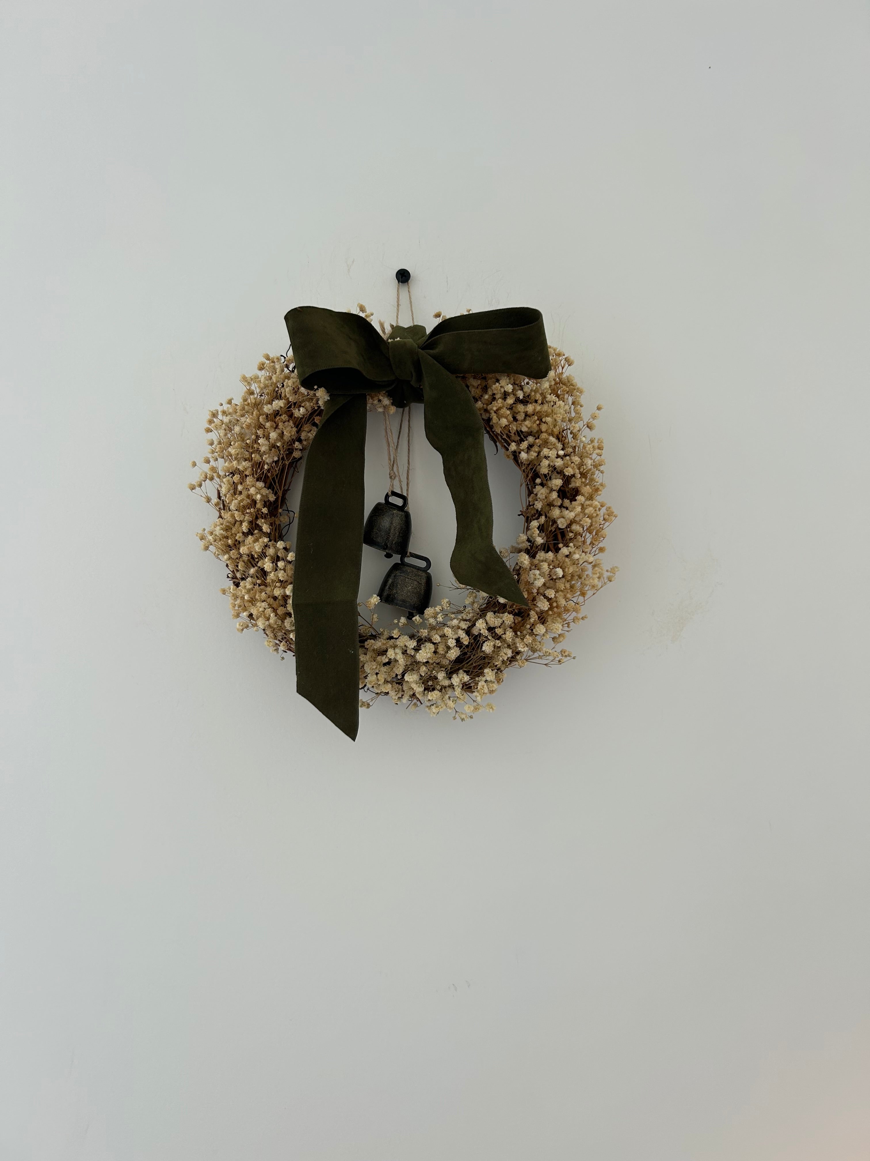 ‘Ivy’ Wreath with Gypsophilas finished with a velvet thick dark green bow and bells