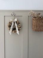 ‘Lux’ Wreath Gypsophilas finished with bells and ivory ribbon