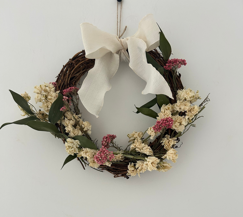 ‘Everlee’ Wreath with White Delphinium’s, Pink Rice Flowers and Ruscus finished with a cream bow 20cm