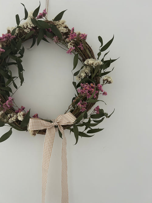 Mabel’ Wreath with Pink Limonium, White Statice, Ruscus finished with a beige gingham bow 30cm