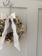 ‘Lux’ Wreath Gypsophilas finished with bells and ivory ribbon