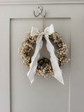 ‘Lux’ Wreath Gypsophilas finished with bells and ivory ribbon