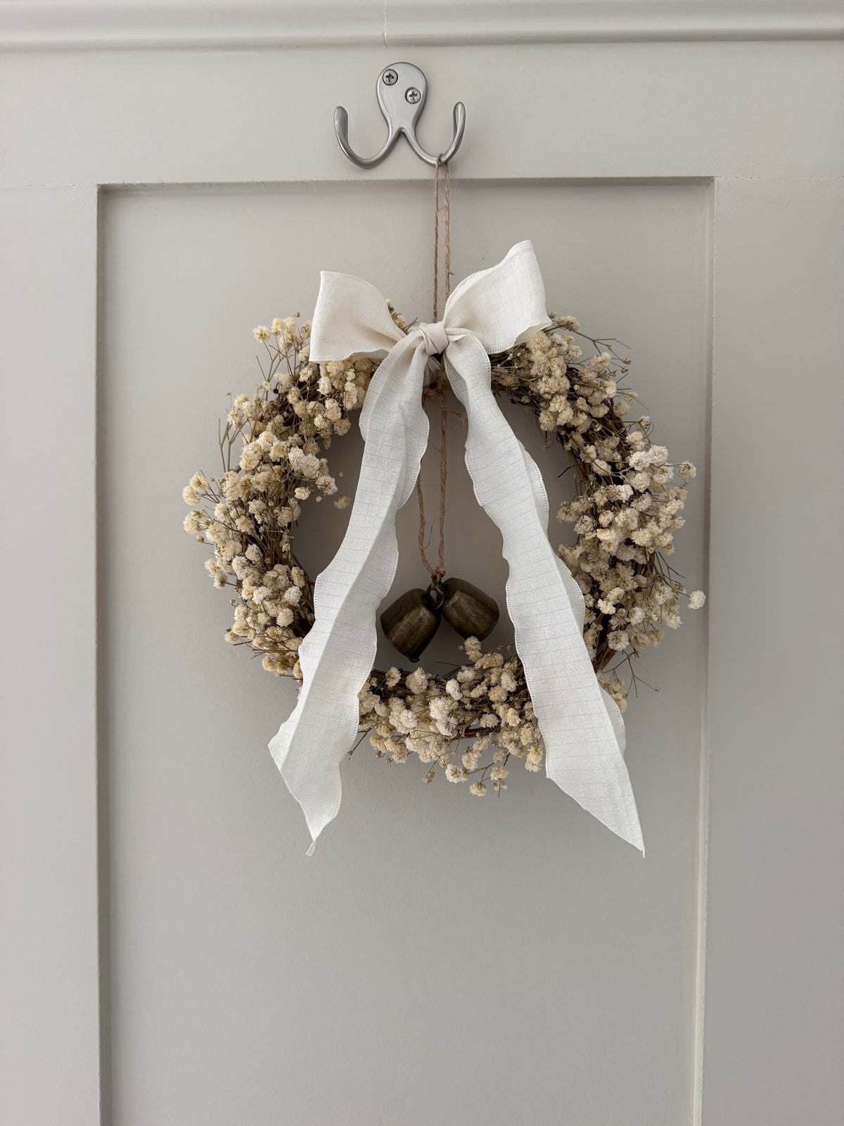 ‘Lux’ Wreath Gypsophilas finished with bells and ivory ribbon