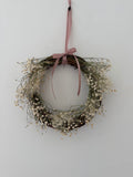 Lois’ Wreath with Gypsophilas and Cotinus coggygria finished with a pink bow 20cm - (included in 15% off offer)