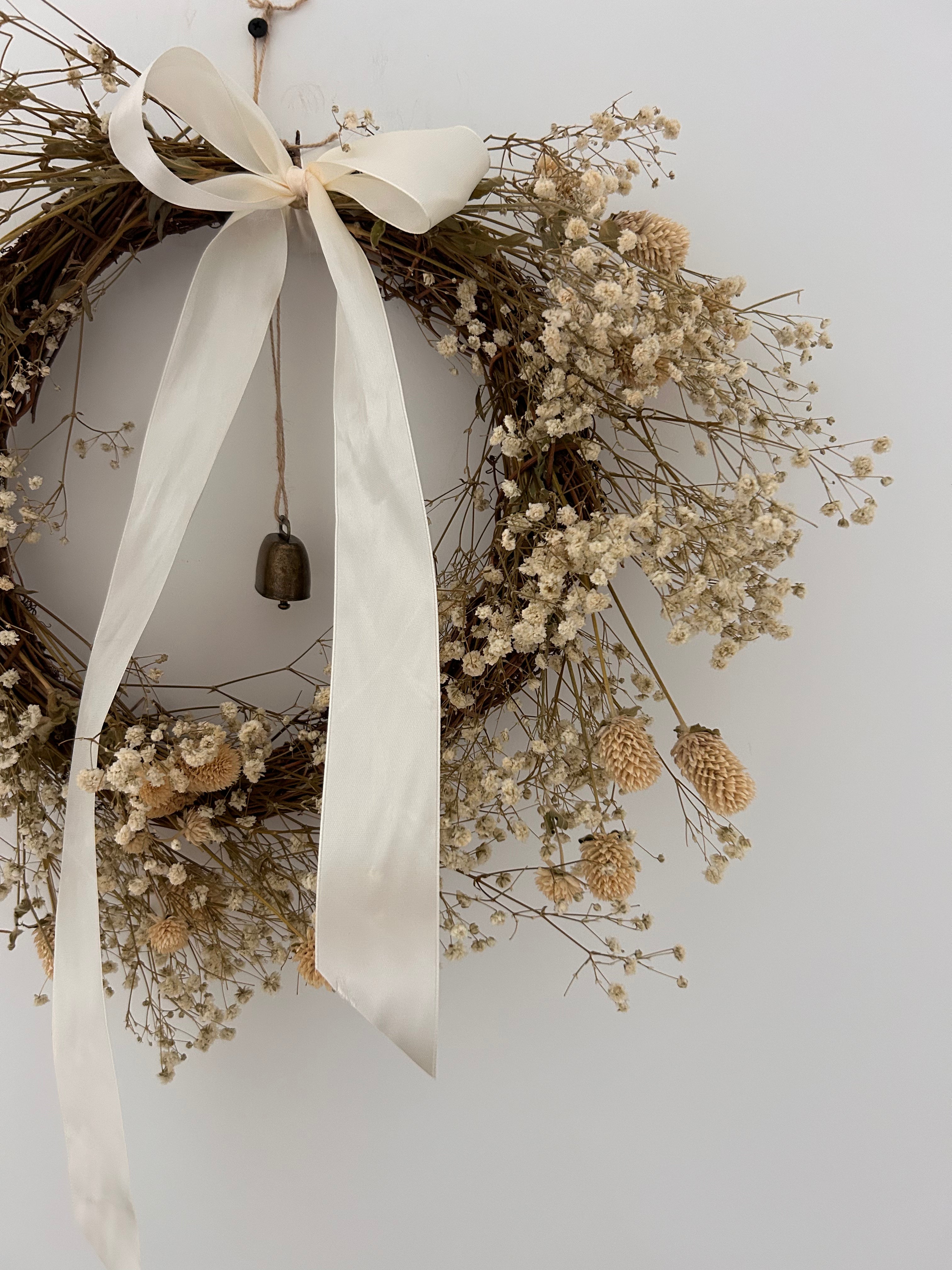 ‘Zara’ Wreath with Gomphrena’s & Gypsophila’s finished with an ivory bow and bell 30cm