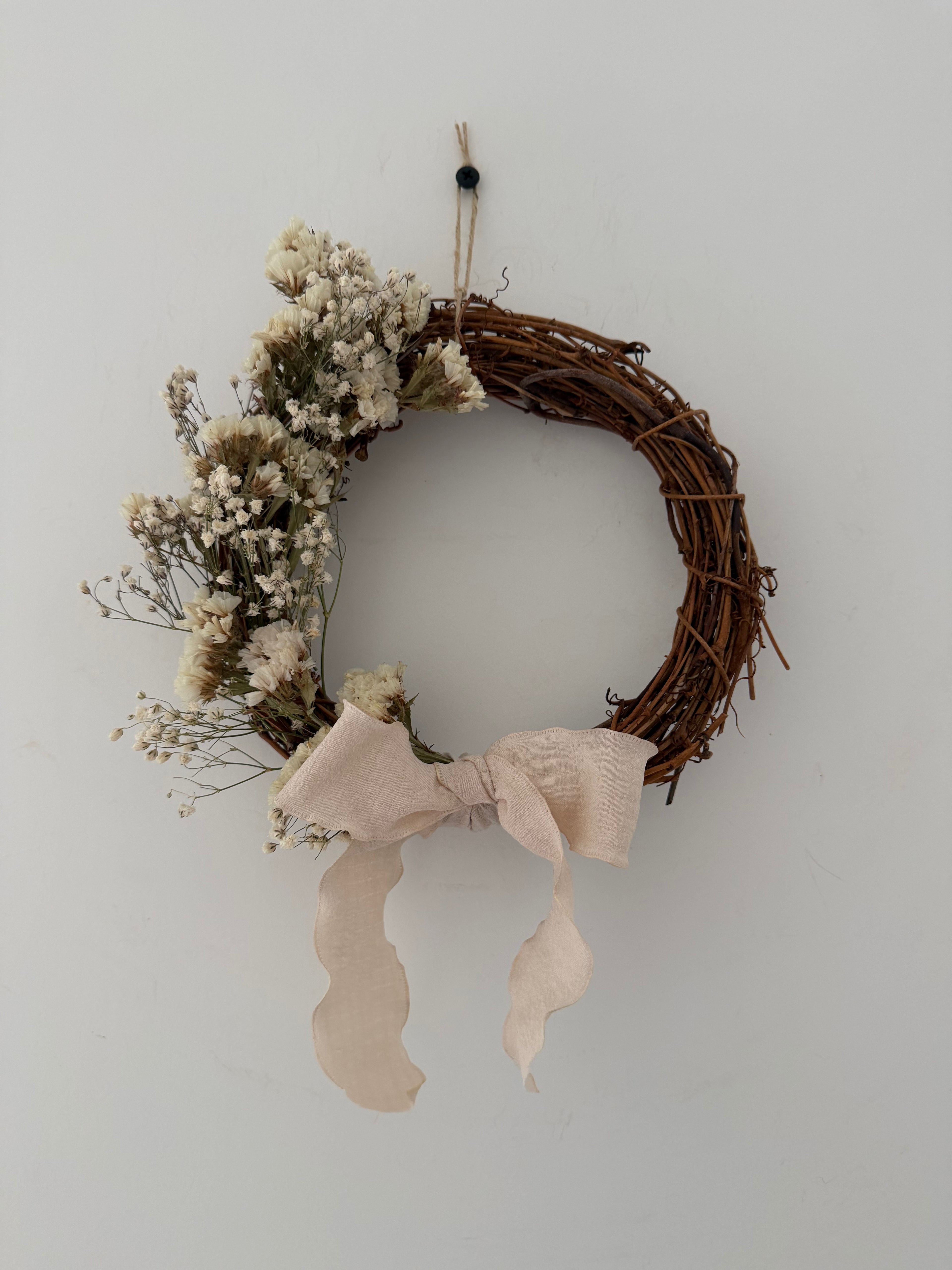 ‘Flora’ Wreath with Gypsophilas and White Statice finished with cream bow 20cm