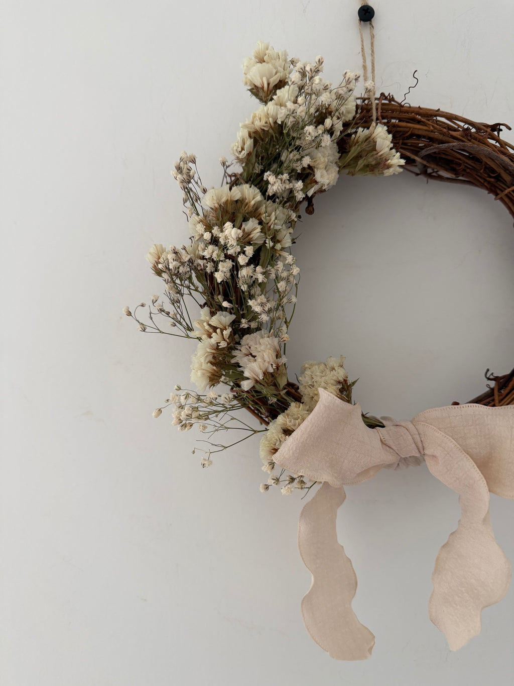 ‘Flora’ Wreath with Gypsophilas and White Statice finished with cream bow 20cm